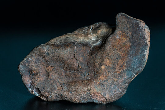 Chondrite Meteorite isolated, piece of rock formed as an asteroid in the universe at during Solar System creation. The meteorite comes from an asteroid fall impacting Earth at Atacama Desert