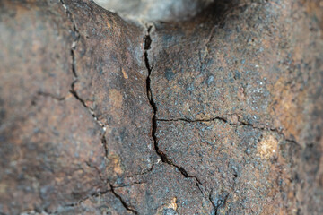 Macro photo of the fusion crust from a Chondrite Meteorite, piece of rock formed in outer space in the early stages of Solar System as asteroids. This meteorite comes from an asteroid fall at Atacama