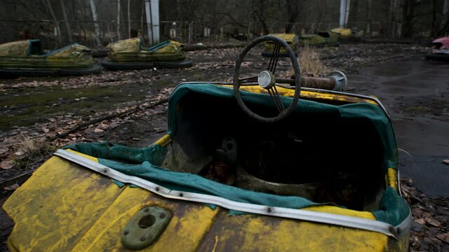 Decayed Autodrome with bumper cars in ghost town Pripyat in radioactive chernobyl exclusion zone