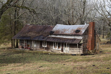 Old, abandoned log cabin in need of repair