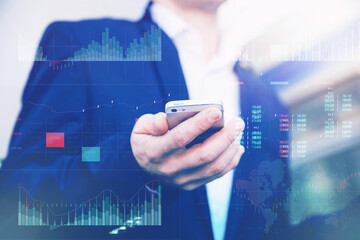 Business analytics with key performance indicators dashboard concept. Businessman in a blue jacket holds a smartphone in his hands.