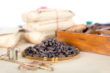 Still life of traditional Chinese medicine xiangfuzi and traditional Chinese medicine box in the scale