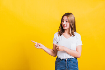 woman teen standing wear t-shirt pointing finger away side