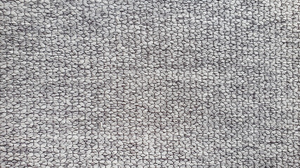 close up of grey plain yarn fabric sample for interior drapery or upholstery work.