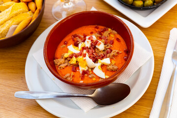 traditional spanish soup with eggs and meat for lunch