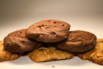  a pile of alomod chocolate cookie on white background