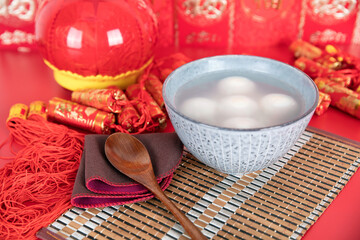 Chinese Lantern Festival food Yuanxiao or Tangyuan on red background