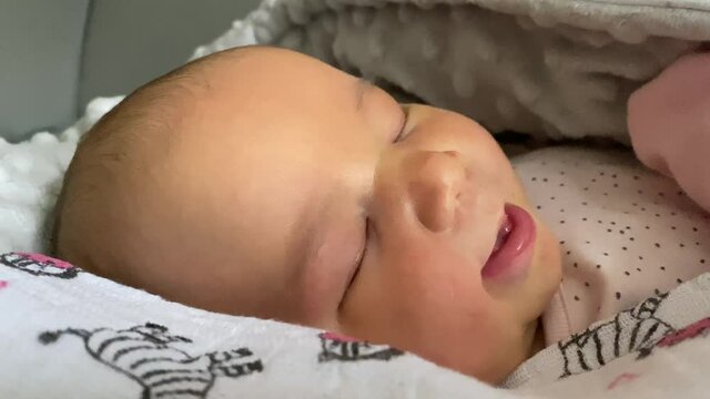 Cute Baby Girl Sleeping Peacefully In Her Bed - close up shot