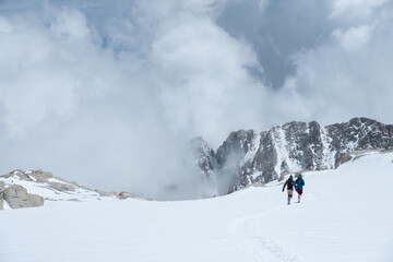 Trail Running in the snow, Sierra Nevada Mountain Range, Snow and cloud cover, Mt Whitney Approach Route, Lone Pine, CA, US, May 25, 2019