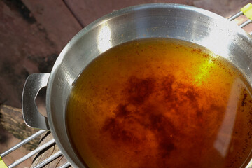 Used vegetable oil in frying pan.