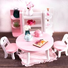 miniature table with h chairs in the living room, living room interior made of wood and plants, minimalistic concept. Miniature Wooden Toy Furniture for Children