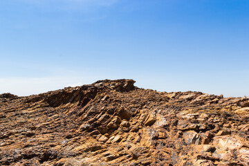 Brow mountain rock blue sky background