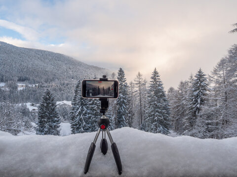 Take video by phone of snowy landscape