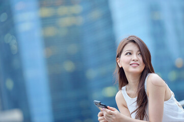 city lifestyle woman with phone outdoor,Young Asian Woman Using Smart Phone