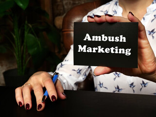 Business concept about Ambush Marketing with inscription on blank business card.