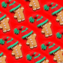 Tasty gingerbread cookies with knitted hats on color background