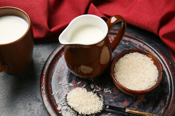 Jug of rice milk on table