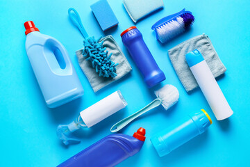 Set of cleaning supplies on color background