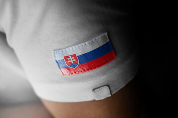 Patch of the national flag of the Slovakia on a white t-shirt