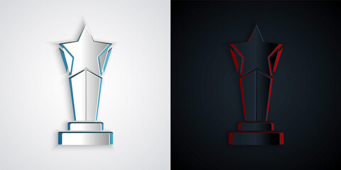 Paper cut Award cup icon isolated on grey and black background. Winner trophy symbol. Championship or competition trophy. Sports achievement sign. Paper art style. Vector.
