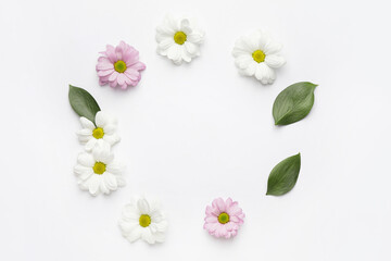 Obraz premium Frame made of beautiful flowers on white background