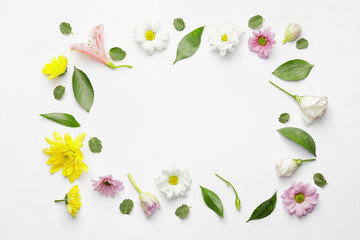Frame made of beautiful flowers on white background