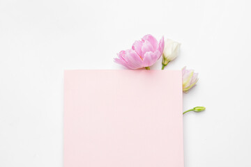 Empty card with beautiful flowers on white background