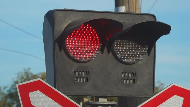 Traffic light or semaphore flashing red at a railway crossing