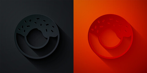 Paper cut Donut with sweet glaze icon isolated on black and red background. Paper art style. Vector.