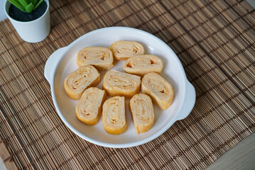 Homemade Tamagoyaki. A plate of egg roll in Japanese Style.