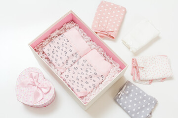 Beautiful women's cotton panties in box on white background.