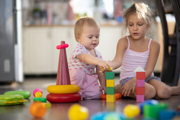 Two children play toys