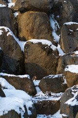 Fototapeta na wymiar Rocks Covered by Snow on a Sunny Winter Day
