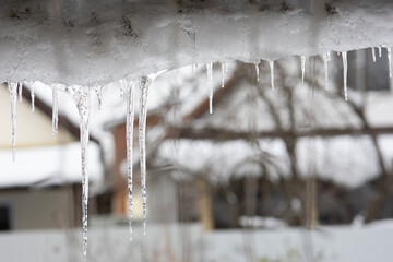 Naklejka na ściany i meble icicles hang from the roof