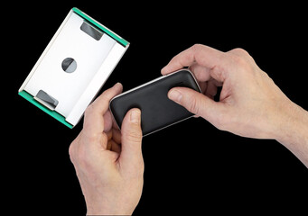 Old man grandpa  unpacks new mass production  mobile phone isolated