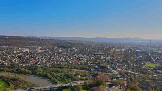 Panoramic view on a small city at above in the autumn over the Uzh River Uzhhorod Ukraine Europe