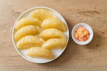 Fresh peeled pomelo, grapefruit or shaddock