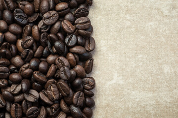 Coffee beans background, empty with copy space for text. Food texture, roasted fragrant appetizing...