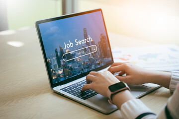 Back view of woman browsing work opportunities online using job search computer app after being...