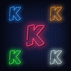 Neon letters, five colors red, blue, green, yellow, white. Isolated font on dark blue brick wall background. Vector illustration eps 10.