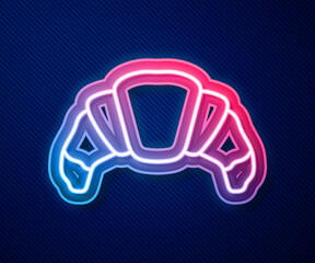 Glowing neon line Croissant icon isolated on blue background. Vector.