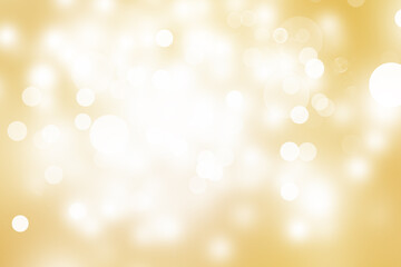 White Golden bokeh blur backdrop. Circle light on yellow background. Light gold sparkle wallpaper.