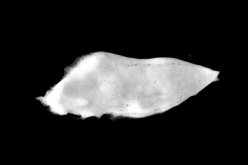 White soapy foam texture. Shampoo foam with bubbles.White facial foam creamy bubble soap sponge isolated on black background.