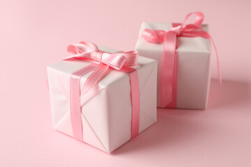 Gift boxes on pink background, close up