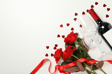 Fototapeta na wymiar Concept of Happy Valentine's day with wine and roses on white background