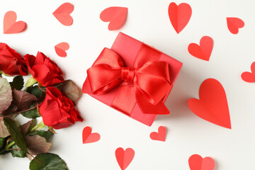Gift box, roses and hearts on white background