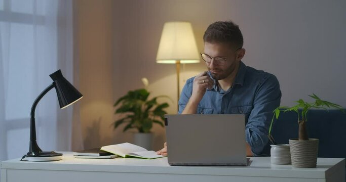 man is getting education online, masters degree, professional development, self-education, looking information in laptop