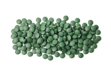 Heap of spirulina pills isolated on white background