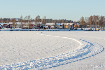 Fototapeta na wymiar ice skating track on a frozen lake