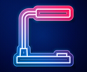 Glowing neon line Table lamp icon isolated on blue background. Desk lamp. Vector.
